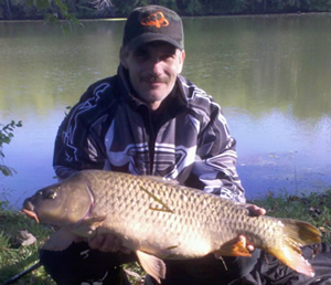 Jamie Godkin poses with a healthy 17 lb 4 oz Common caught at Lion's Community Park in Baldwinsville during Session 4)