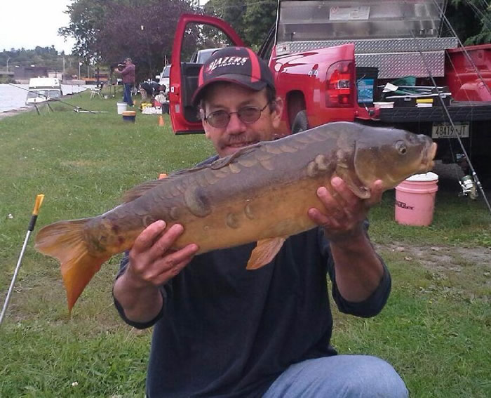 Bill Markle with a 12.2 lb mirror carp caught during session 6 of tue Wild Carp Club of Central NY in Fulton, NY.