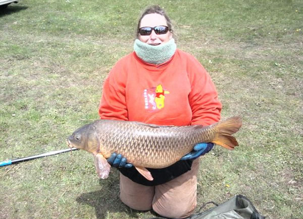 Diane Matthews with a 22 lb, 4 oz common caught during session 4 of the Wild Carp Club of Central NY