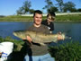Justin Mary with a very long grass carp caught during session 2 of the WIld Carp Club of Houston, TX