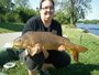 Sam Reid with one of her first 2 carp caught during Session 3 in Lowell, MA.