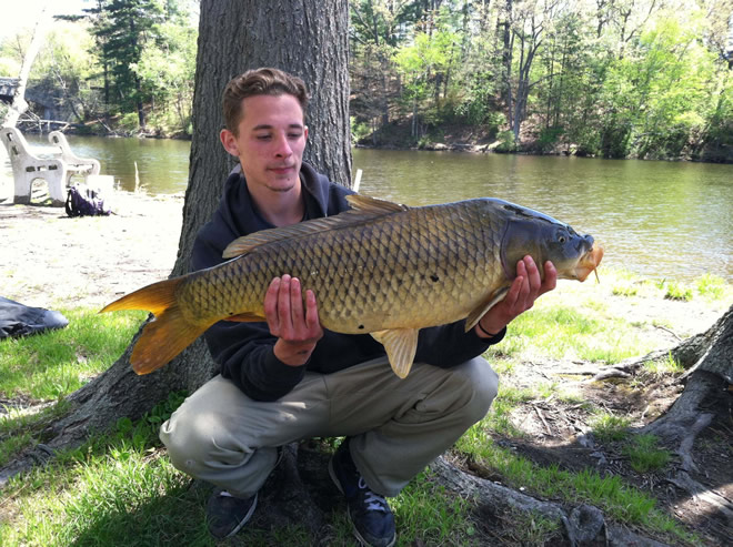 Joey Shattuck with a common carp caught during session 1 of the Wild Carp Club of New England