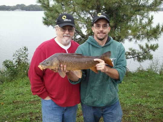 Vaughan Osmond (left) and Scott Osmond (right) with a common carp caught during session 6 of the Wild Carp Club of New England