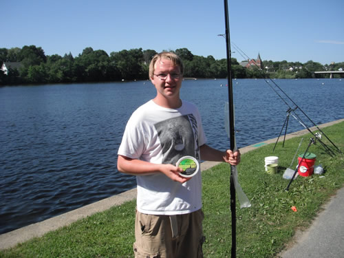 Zach Randlett displays his prizes won for big fish during session 4 of the Wild Carp Club of New England