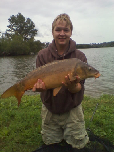 Zach Randlett with his personal best mirror carp--11 lb, 13 oz--caught during session 5 of the WIld Carp Club of New England