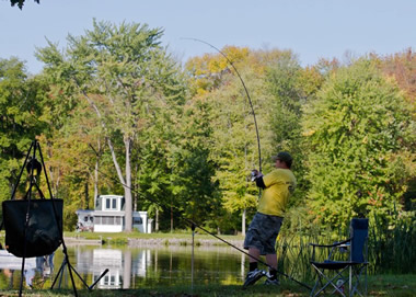 Jason Bernhardt reeling in a carp during Session 5. Liverpool, NY