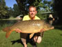 Chris West with a 22.12 lb common, the hour 9 winner.