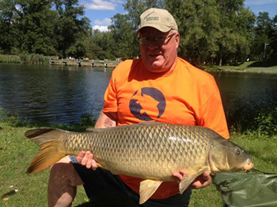 Fred Pickard with a 32.0 lb hour-winning common caught during the August 18, 2012 CNY Shootout in Liverpool, NY.