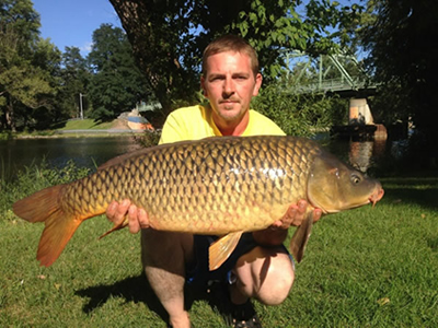 Chris West with a 22 lb, 12 oz hour-winning common caught during the August 18, 2012 CNY Shootout in Liverpool, NY.