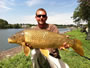 Chris West with an hour-winning 16 lb, 3 oz common caught during the August 13 Shootout in Fulton, NY