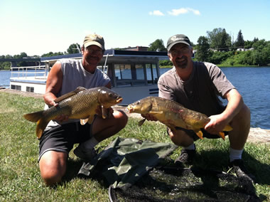 Bill Markle (left) and Kent Appleby (right) pose with two nice catches
          during the July 9 Shootout in Fulton, NY
