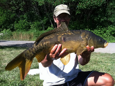 Bill Markle with a mirror carp caught during the July 9 Shootout in Fulton, NY
