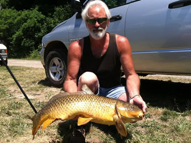 Joe Rinaldo with a 15 lb, 7 oz common caught during the July 9 Shootout in Fulton, NY
