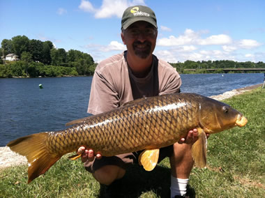 Kent Appleby with a 15 lb, 12 oz common caught during the July 9 Shootout in Fulton, NY