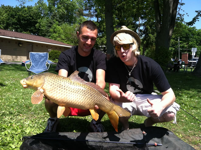 Ivan Petrov (left) and celebrity partner Wade Live (right) celebrate their 12 lb carp caught shortly after the conclusion of the 2012 JGB Celebrity Carp Challenge in Baldwinsville, NY. 