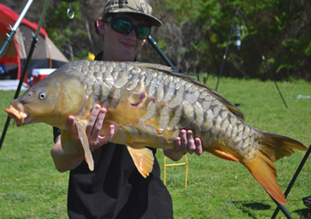 Austin Anderson with a 19.3 lb mirror carp caught in Texas from Purtis Creek Lake