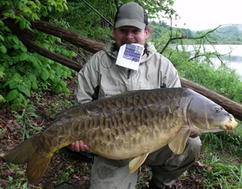 WCC of New England Director Robert Duprey with a beautiful fully-scaled mirror carp